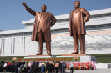 1280px The statues of Kim Il Sung and Kim Jong Il on Mansu Hill in Pyongyang april 2012 e1582112282848
