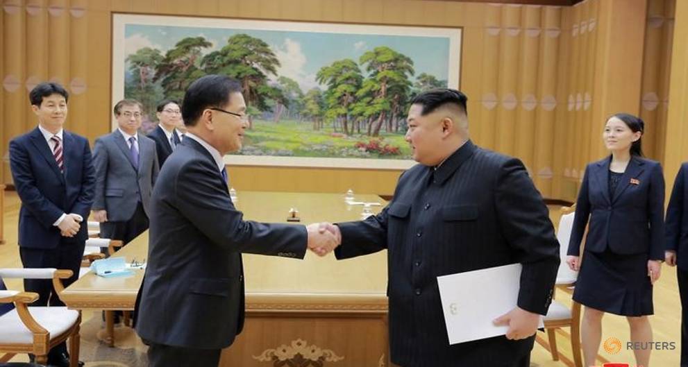 Kim Jong un bat tay quan chuc Han Quoc