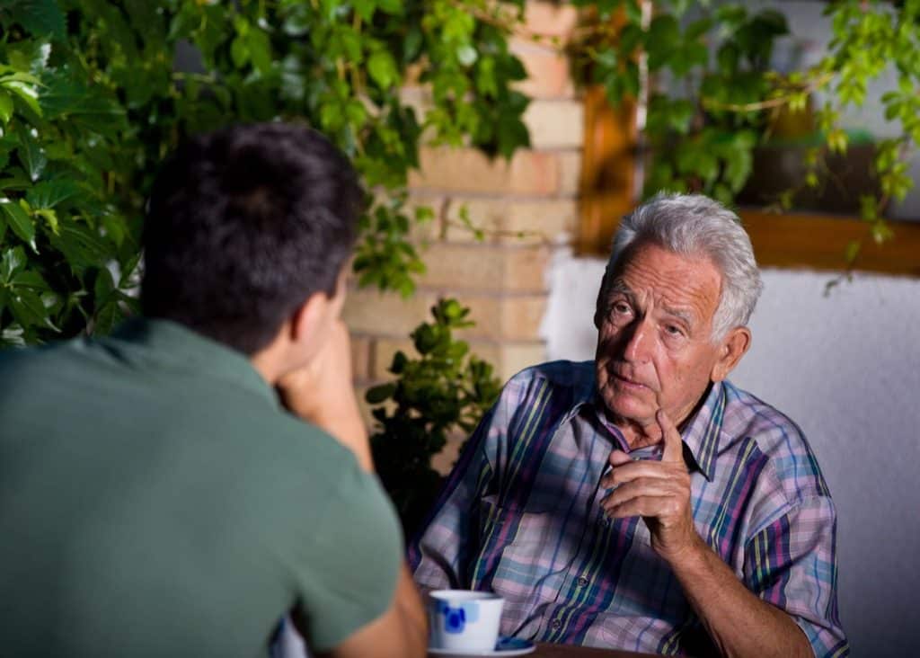 young man talking to old man conversationalist 1024x732