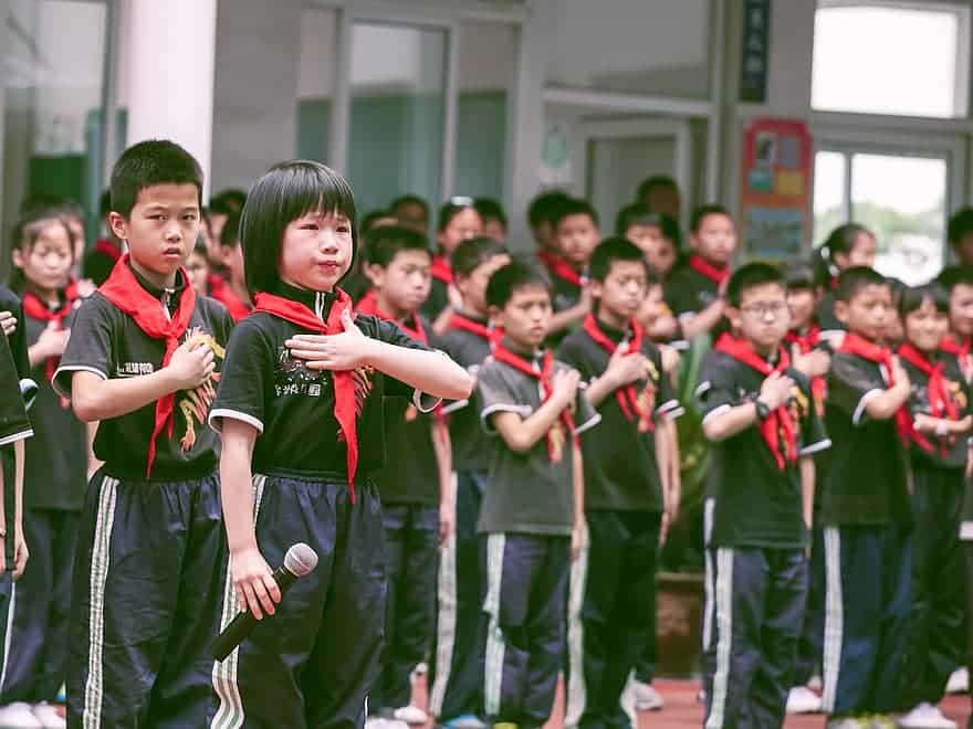 pupils school children red scarf queue